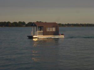 Tiny floating cottage at sea